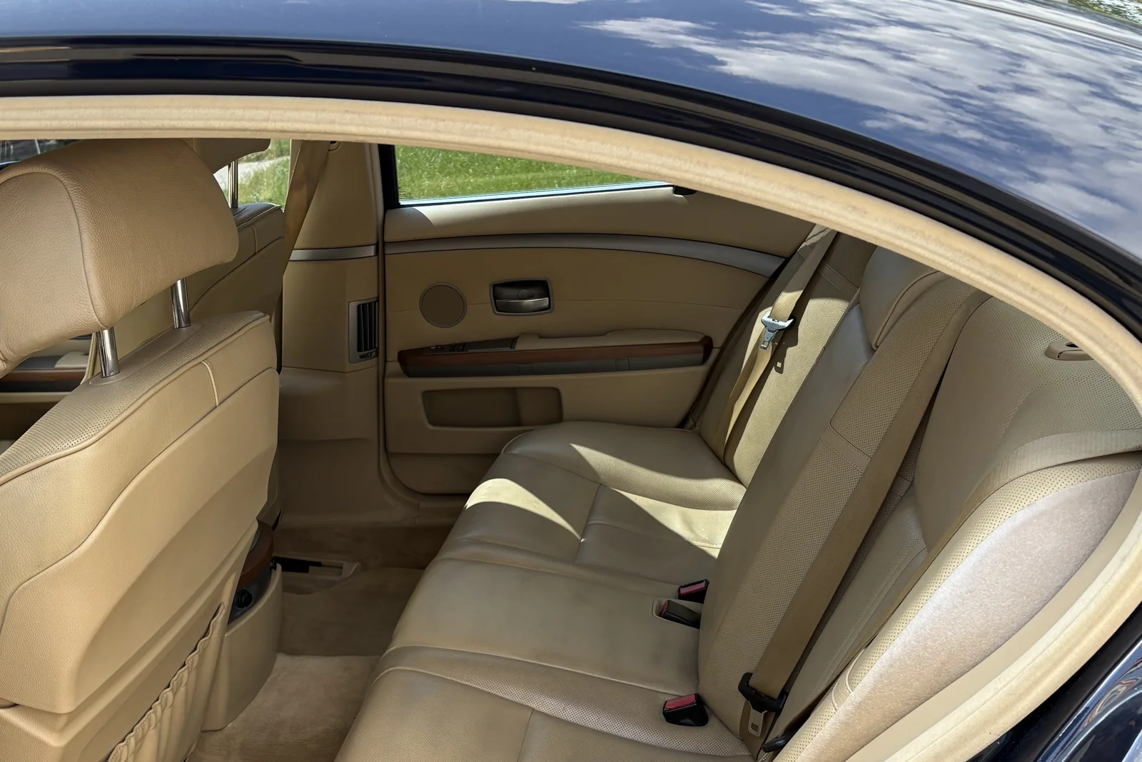 Back seat of the Cloud 9 BMW 750i sedan in tan leather