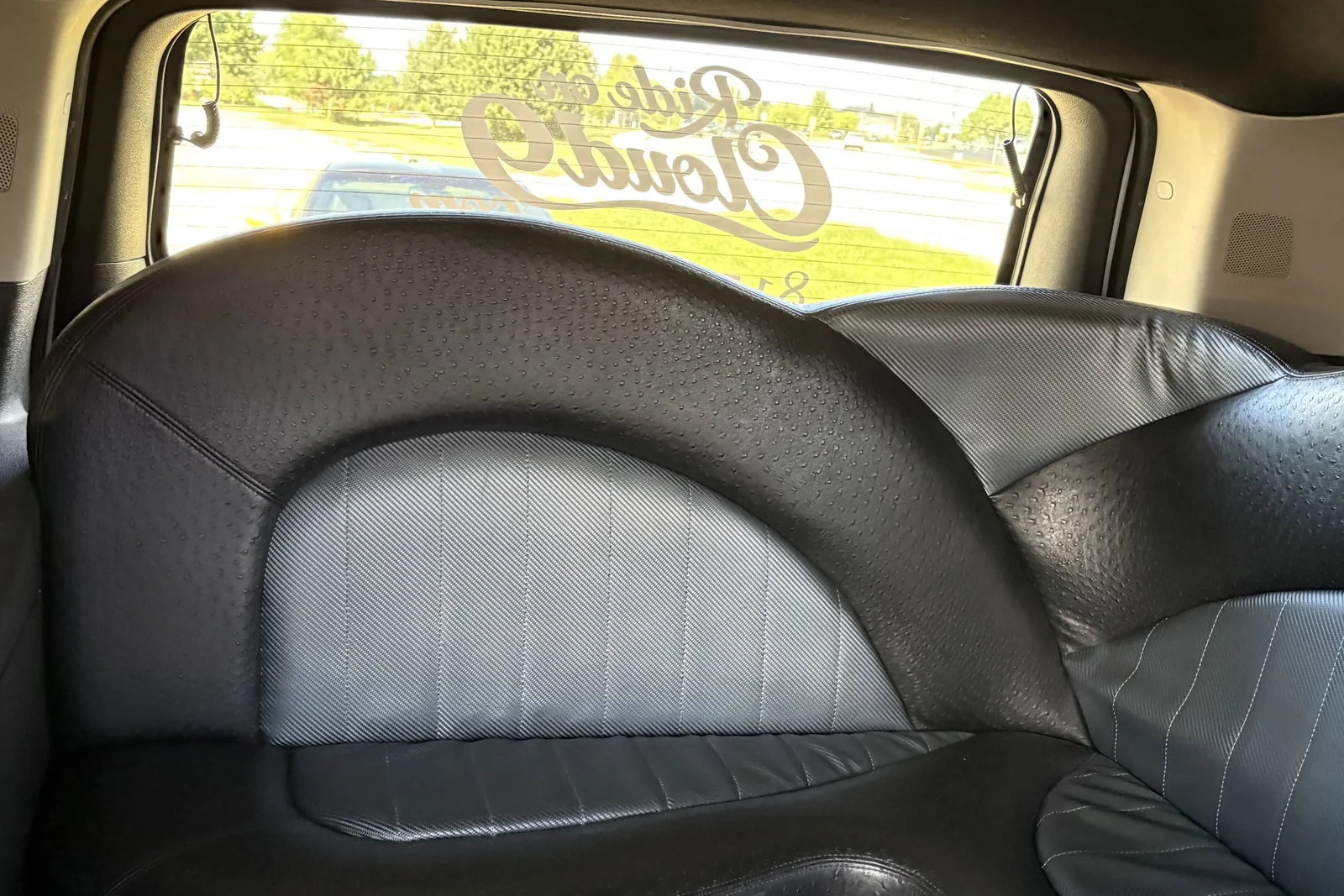 Rear bench seating inside the Cloud 9 stretch limousine